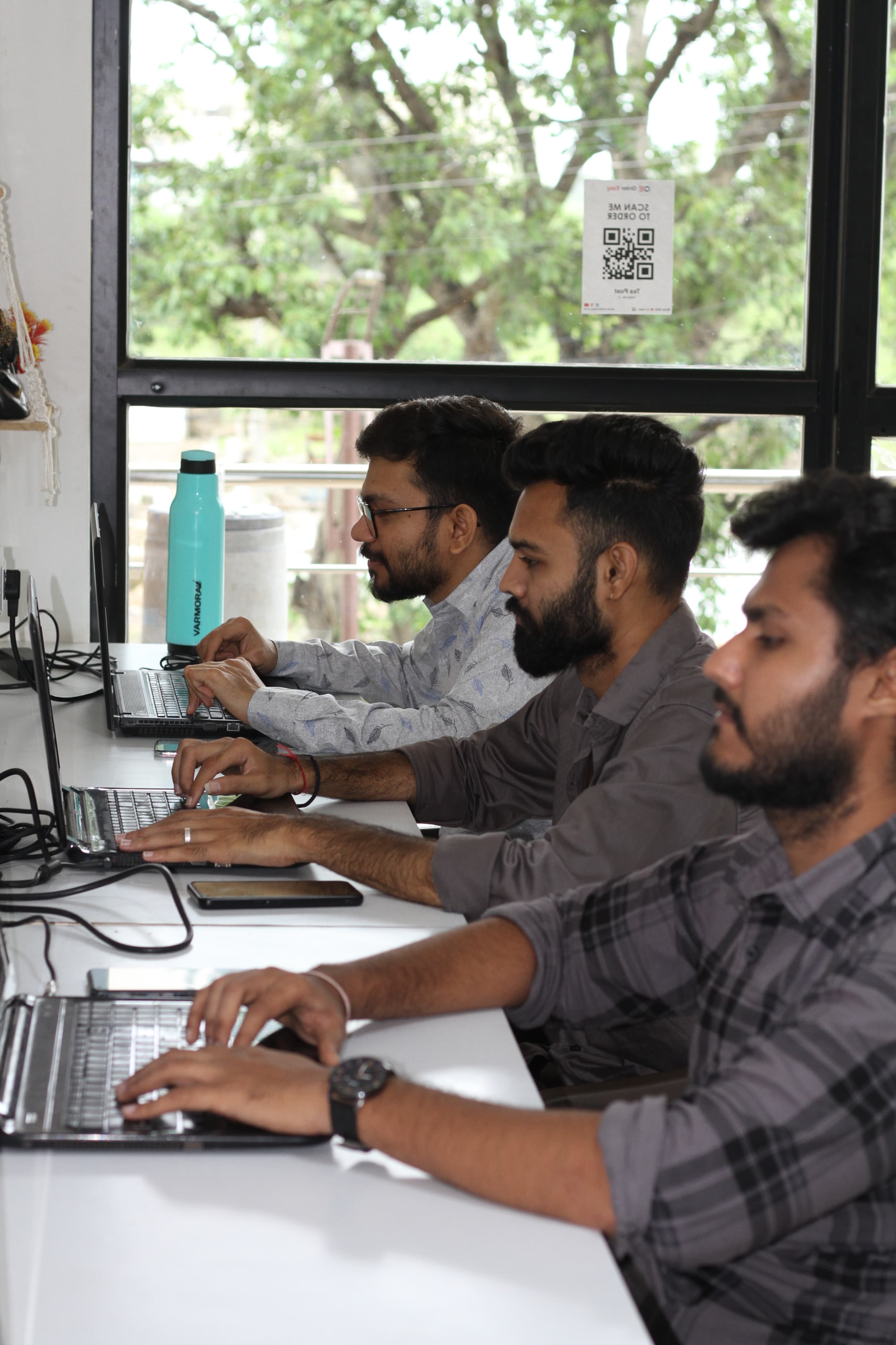 Our team collaborating on innovative software development projects in a creative workspace
